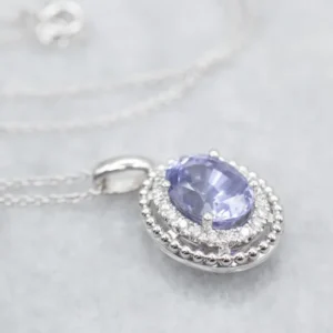 Sapphire and Tweeling Diamond Halo Pendant Necklace